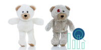 Symbolic image Retrofit- A clean happy stuffed bear and a dirty, patched, stuffed bear.