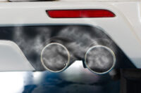 Exhaust fumes from the exhaust of a sports car
